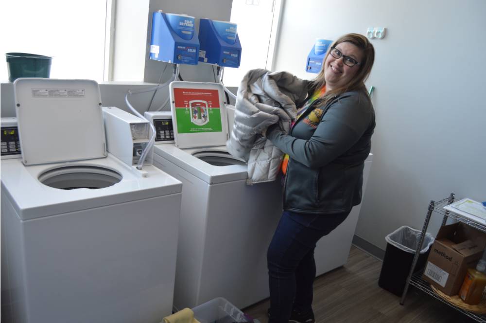 Alumna doing laundry